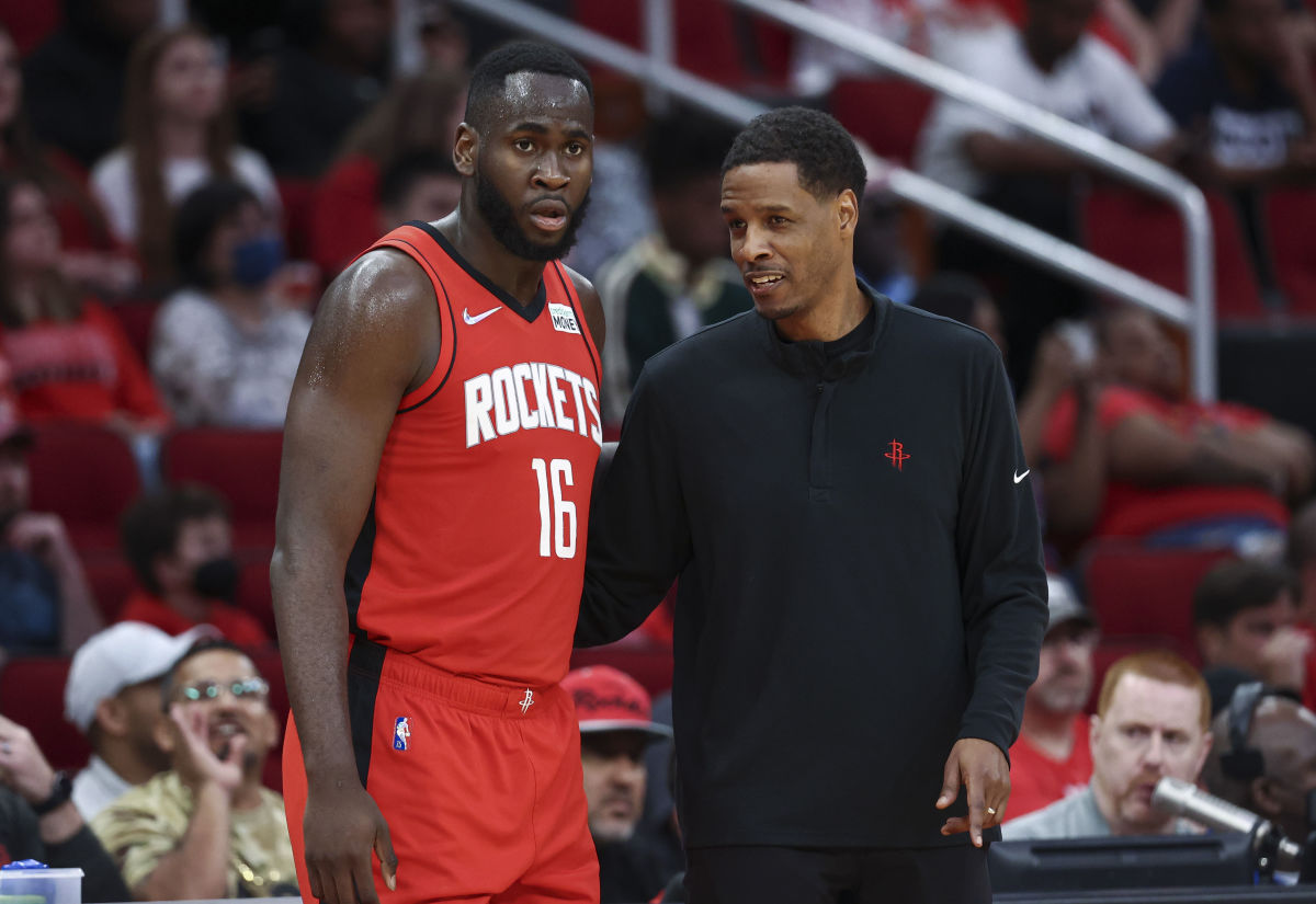 Apr 10, 2022; Houston, Texas, USA; Houston Rockets head coach Stephen Silas talks with forward Usman Garuba (16) during the fourth quarter against the Atlanta Hawks at Toyota Center. Mandatory Credit: Troy Taormina-USA TODAY Sports